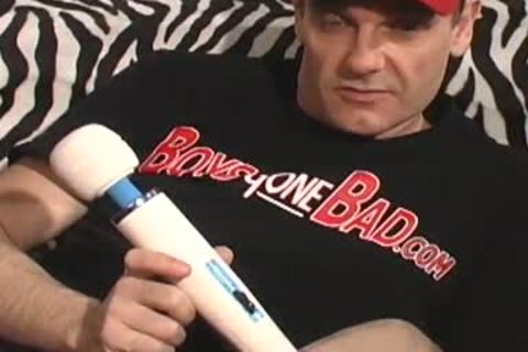 Daddy lays on the floor and uses a sextoy